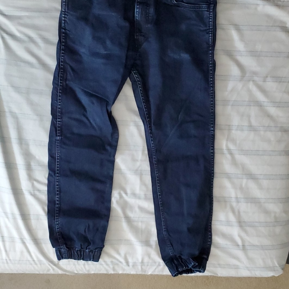 Distressed Blue Levi's 513 Jeans